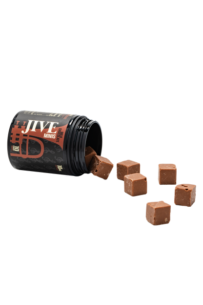 JIVE Dark Chocolate Minis coming out of the jar. Black jar with brown label. 
